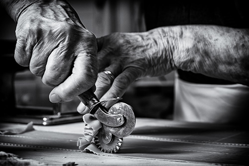 hands working pasta
